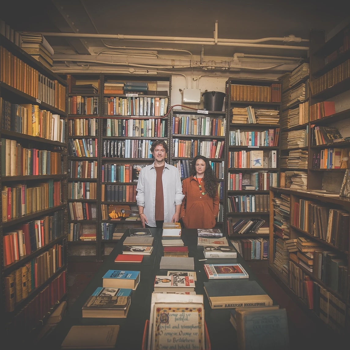Photo of the Bookshop Band members in a bookshop